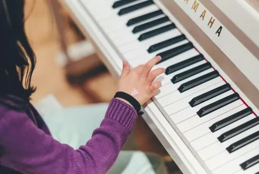 girl playing piano